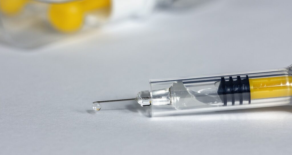 A syringe with a needle attached